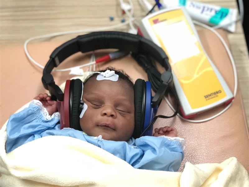 Little Baby with Headphones listening